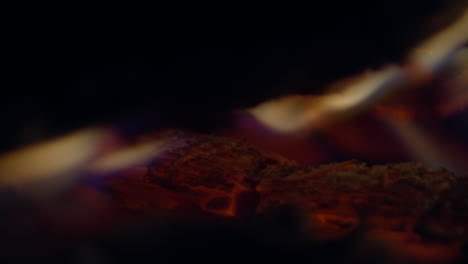 Slow-motion-shot-of-flames-and-embers-in-a-fireplace