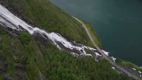 Torrent-of-white-water-crashing-down-mountain-slope,-Langfoss-Waterfall