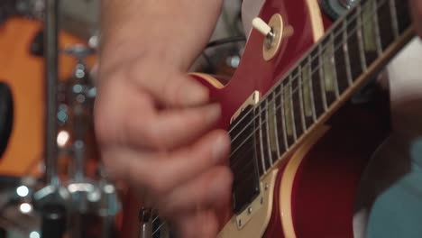 guitarist plays the guitar as part of the band