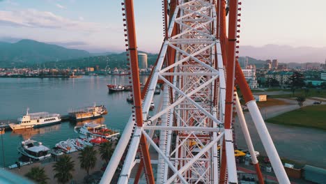 first-person view from the cab on the ferris wheel near the sea. pov