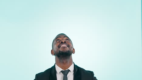 Business-man,-pointing-up-and-excited-in-studio