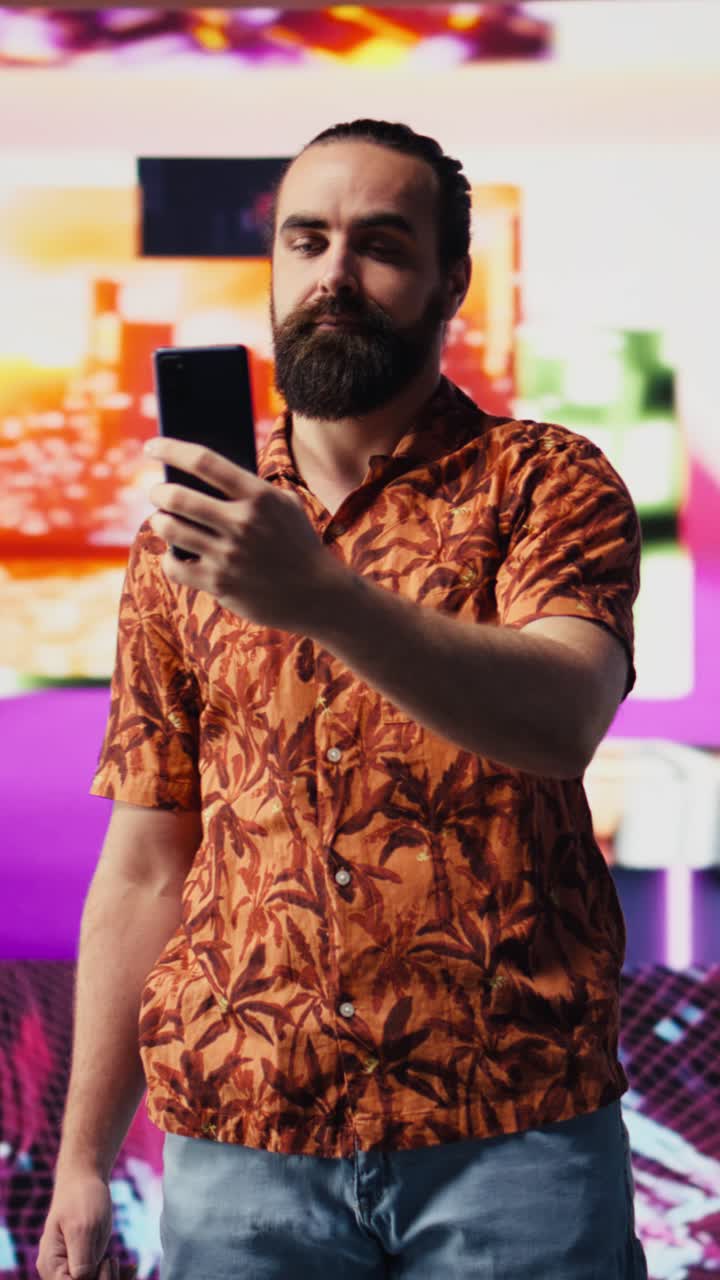 Vertical Video Young male performer feeling carefree with selfies and videos of himself