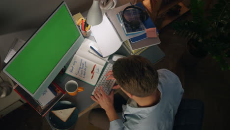 Involved-freelancer-typing-chromakey-computer-closeup.-Man-browsing-internet