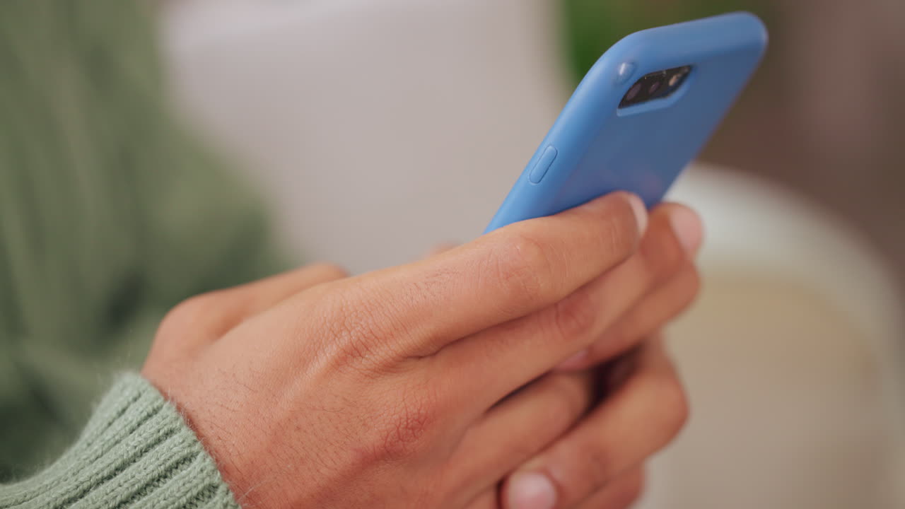 Person Using Blue Cellphone