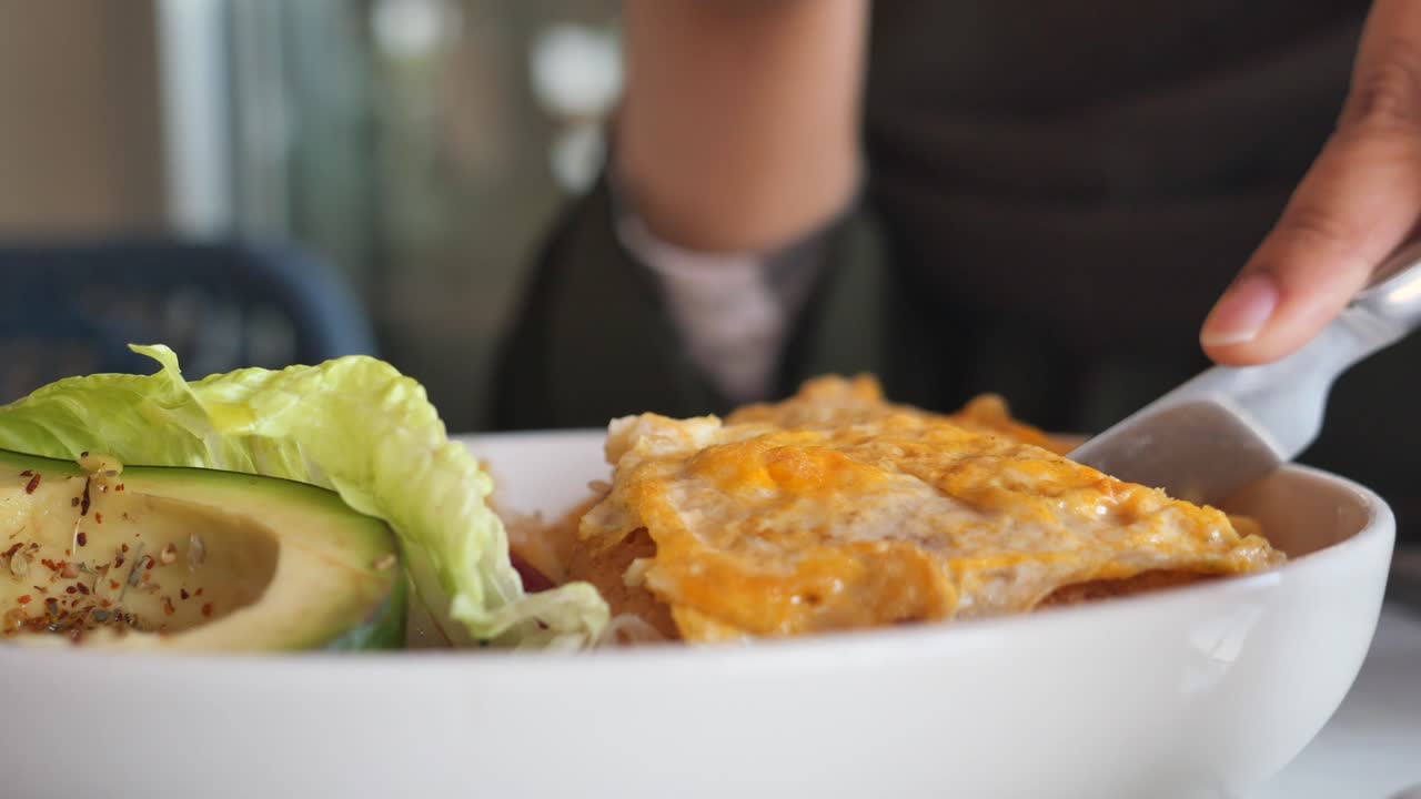 Eating a salad with an egg