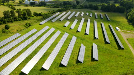 landscape of solar cell panels in photovoltaic power plant near gdansk, pomerania, poland - aerial shot