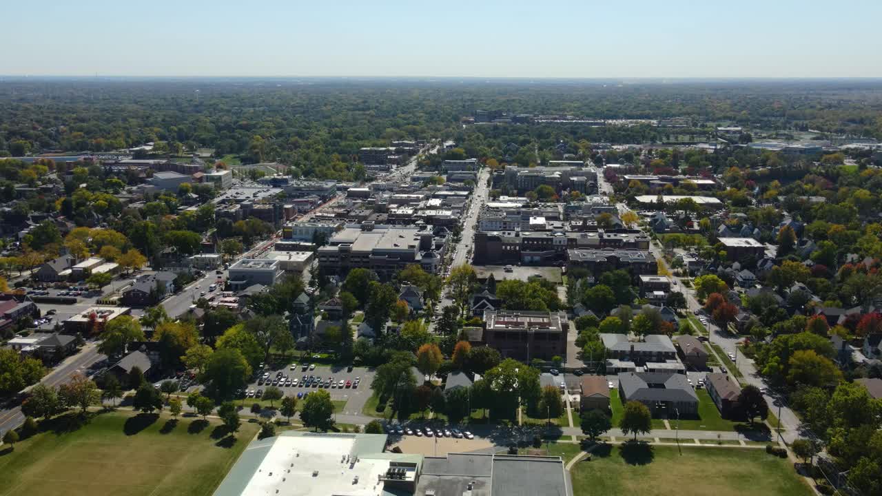 Naperville, IL, a Chicago suburb, on a sunny fall day, featuring buildings, streets. Orbit Left Day S