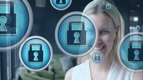 animation of digital padlock icons over smiling caucasian businesswoman in office