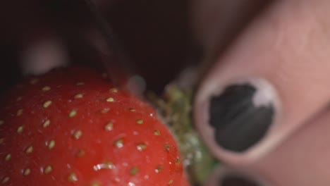 cutting the tip part of the strawberry