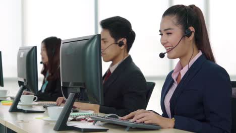 Business-people-wearing-headset-working-in-office