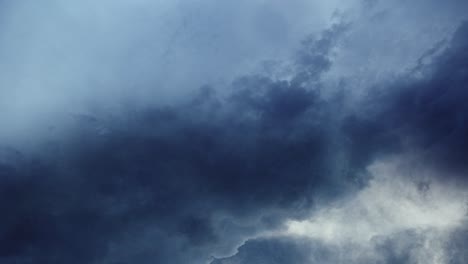 timelapse, blue sky and moving cumulonimbus clouds with thunderstorm