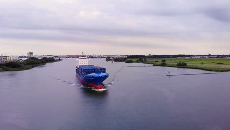 tailwind panda container ship transporting stack of intermodal across the river