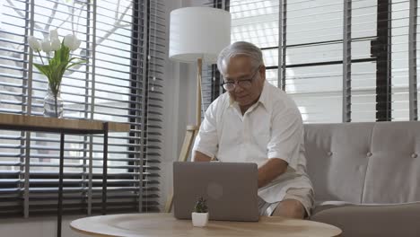 middle-aged male demonstrating joy in using portable technology