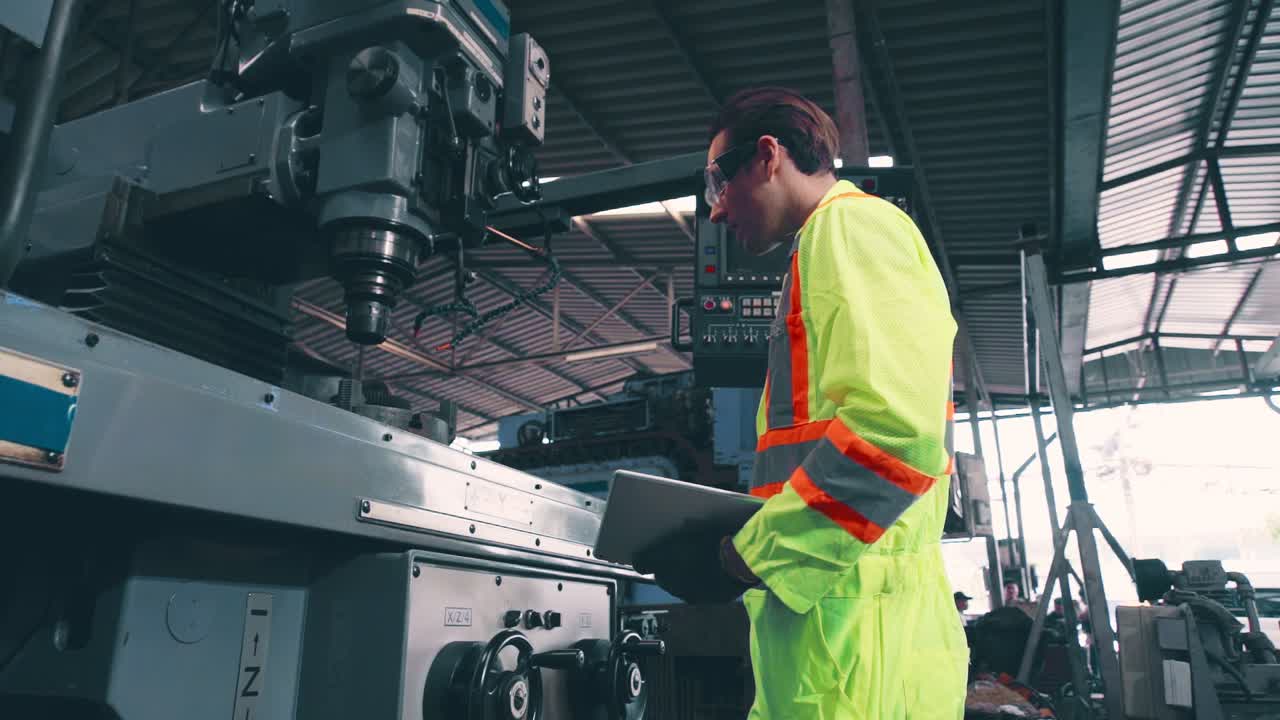 Smart factory worker using machine in factory workshop