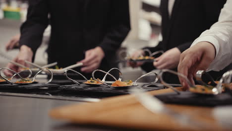 waiters serving food at a restaurant