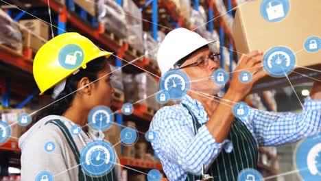 Animation-of-network-of-connections-with-icons-over-man-and-woman-working-in-warehouse