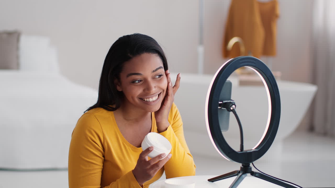 Woman Reviews Skincare Cream on Social Media