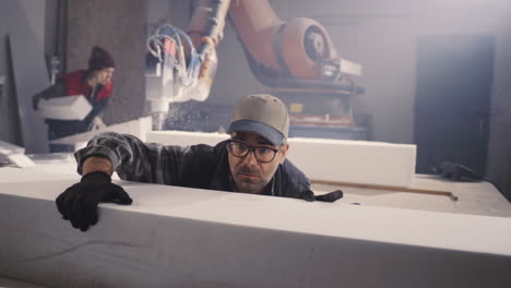 foam processing and manufacturing with robot and workers