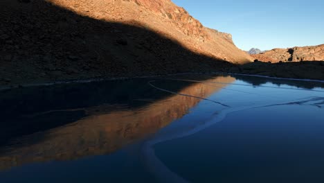 frozen alpine lake at sunrise/sunset