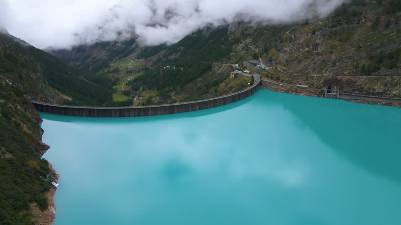 Drone shot flying around the Place Moulin dam in the province of Aosta in Italy