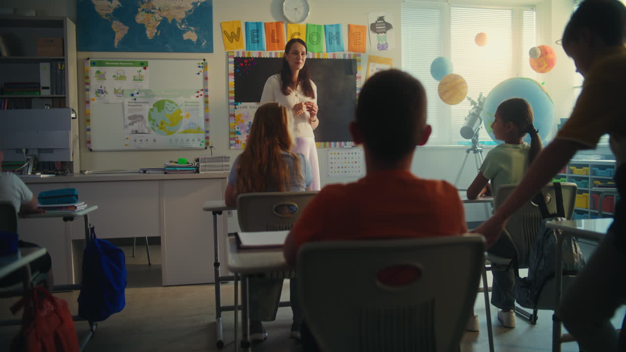 Primary School Boy Presenting Homework on Renewable Energy Resources in Front of Class