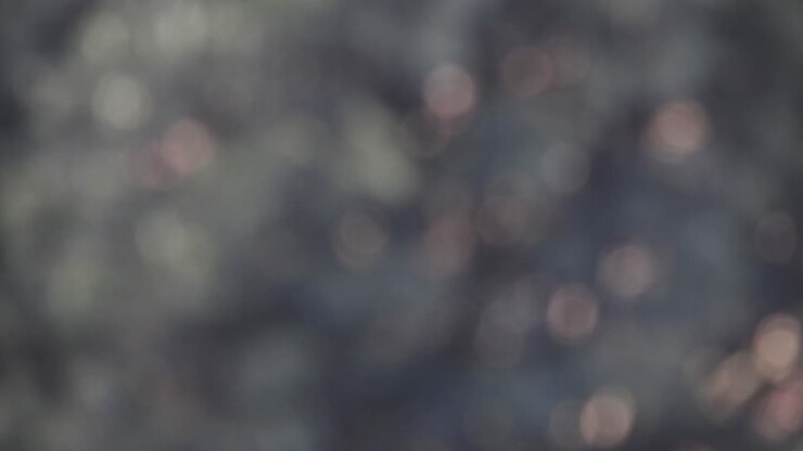Bokeh blur tree leaves swaying and moving in the wind, light flicker rays simple moving background