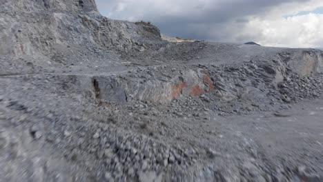 fast aerial over stone quarry steps partially cloudy day