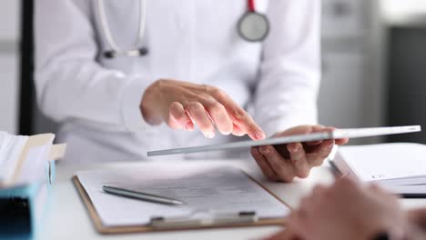 doctor works with tablet at appointment with patient slow motion 4k movie