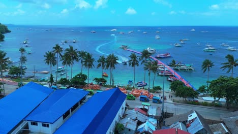 stunning 4k aerial shot of boracay's vibrant harbor with boats, palm trees, and turquoise waters—perfect for travel, tourism, and tropical lifestyle content