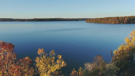 fall colors by the lakeside - low altitude aerial view