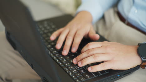 shot of hands typing on laptop quickly