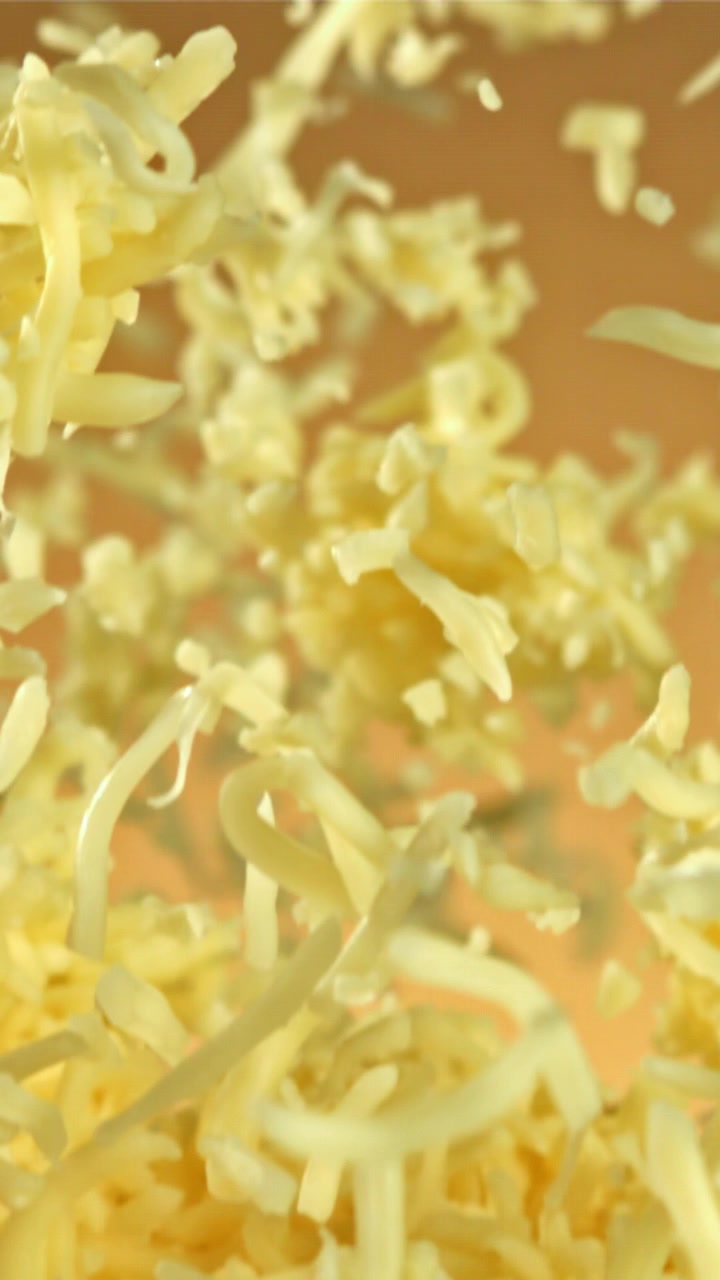 Shredded Cheese Falling and Floating in Slow Motion