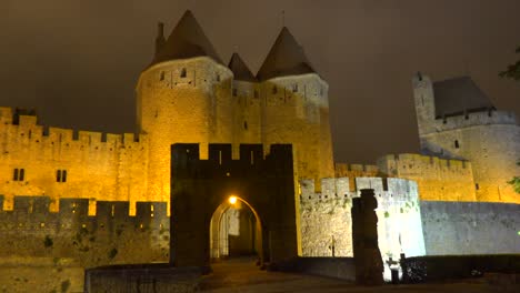 the walls and ramparts of the beautiful carcassone fort in the south of france at night  1