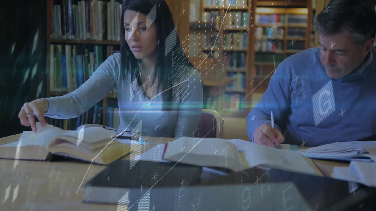 When female partner flipping page, male writing notes while data overlays guiding library study