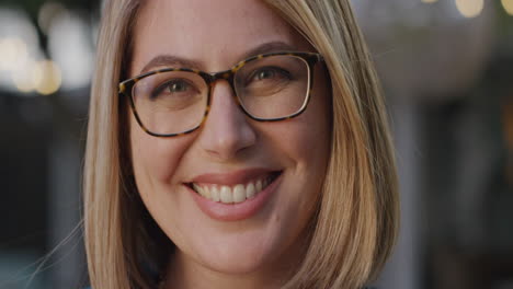 close up portrait beautiful woman wearing glasses smiling outdoors