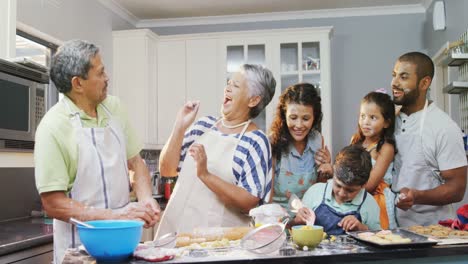 Family-having-fun-while-preparing-cookies-4k