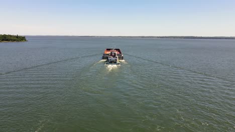 boat sailing on the paraná river between argentina and paraguay