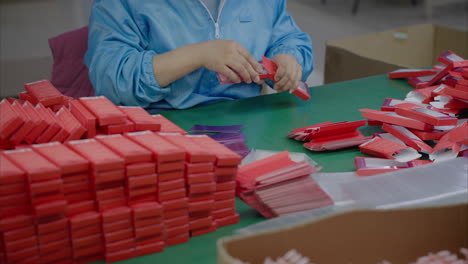 worker is packaging products at a factory