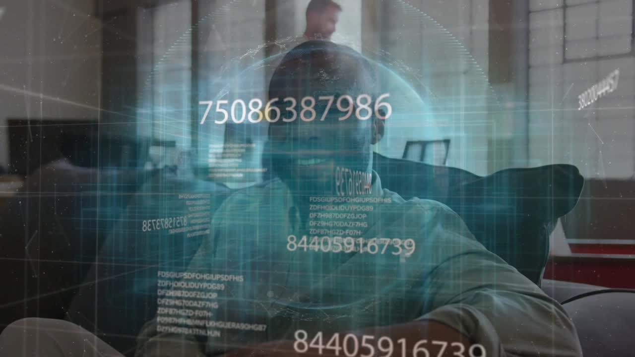 Mid adult man on couch observing globe hologram flowing technology data, senior peer pouring coffee