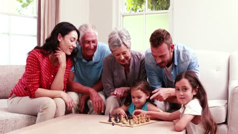 Smiling-family-playing-chess