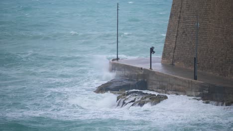 view of the edge of valletta malta by the shoreline