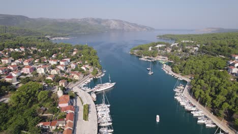 Aerial-Stari-Grad,-Hvar:-Marina,-boats,-and-town-by-serene-Croatian-waters