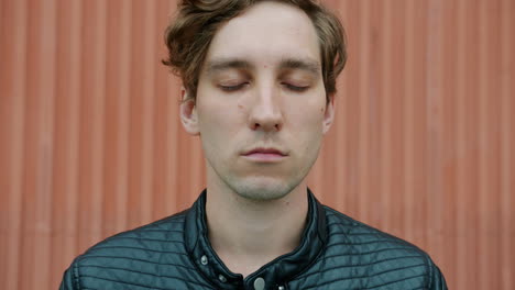 young man with closed eyes