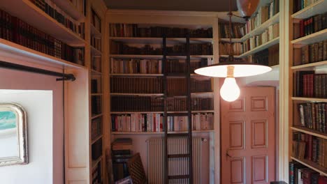 scenic library room with shelves full of books in french castle