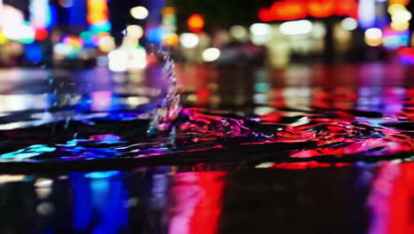 rainy night city street puddle splash