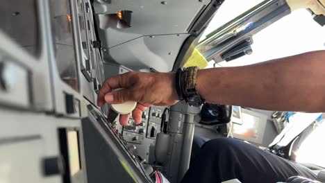 Scene-in-the-airplane-cockpit-showing-the-pilot-lowering-the-landing-gear-lever-in-a-real-fight