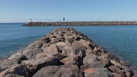 Aerial-view-of-reef-at-Waianae-small-boat-harbor-in-tranquil-sunny-day