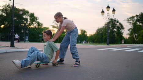 children skateboarding in a park