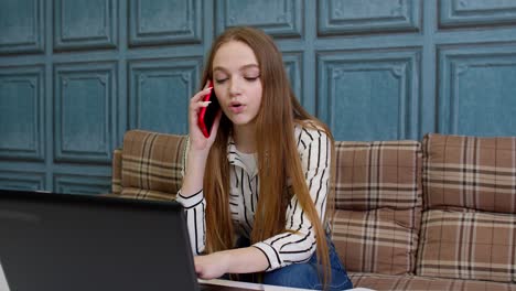 Young-business-woman-consultant-making-distant-video-call,-working-on-laptop-computer-at-home-office