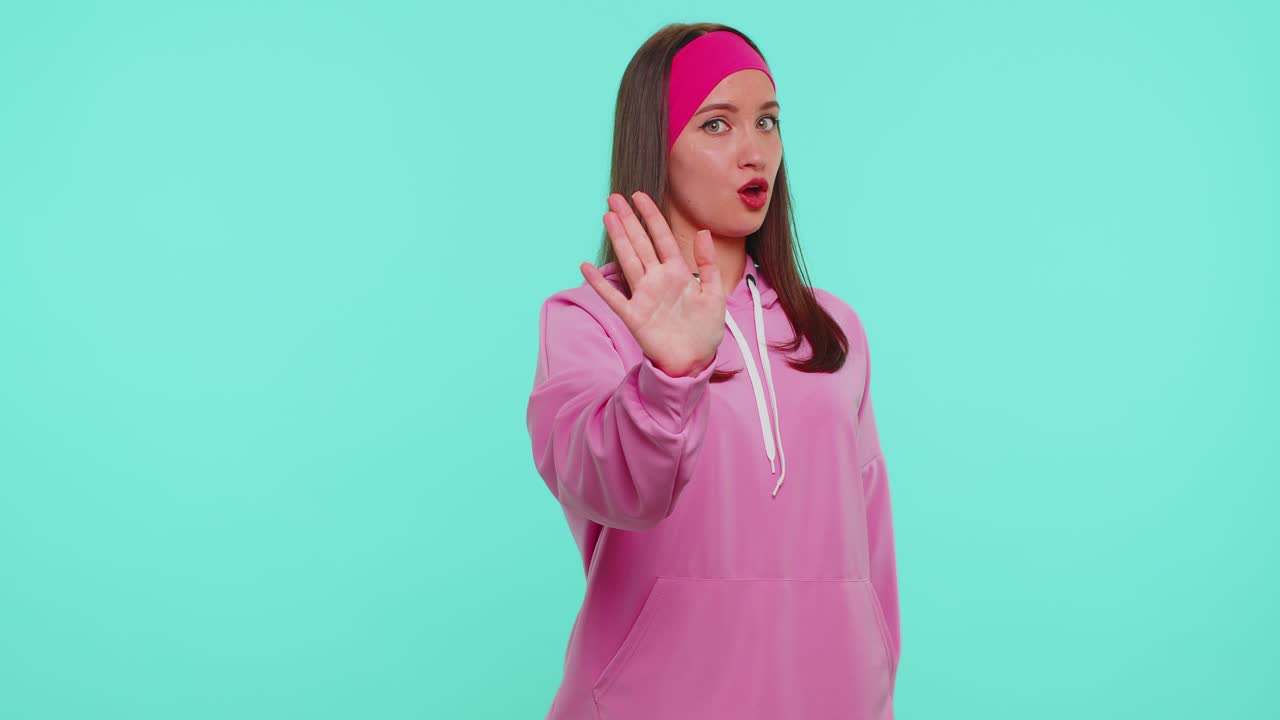 Girl say no hold palm folded crossed hands in stop gesture warning of finish prohibited access